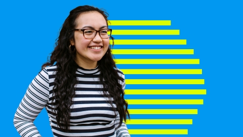 Student smiling on a blue background with yellow horizontal lines