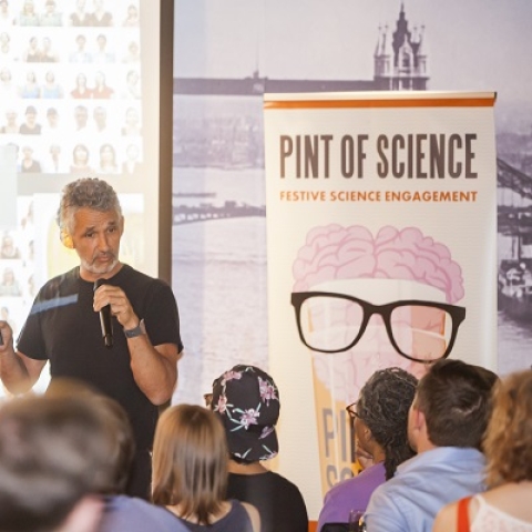 Expert speaking at a pub for pint of science festival