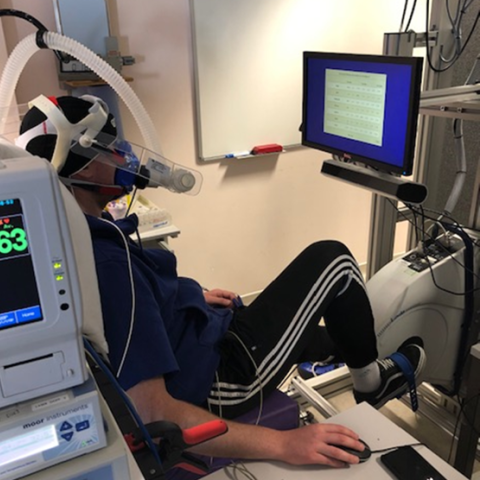 Man cycling in a PET scanner as part of a new study