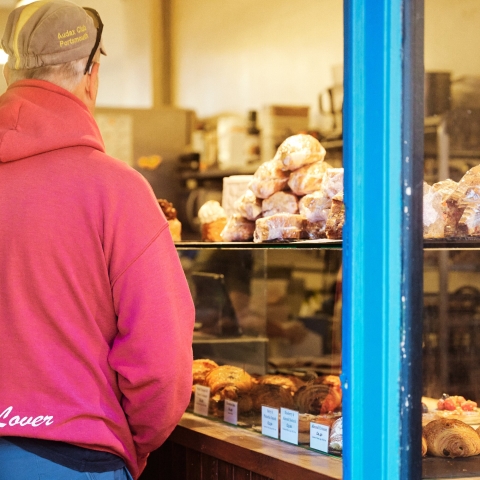 Shopper in Pink Hoodie examining food on display
Bread Addiction - Elm Grove - City Guide 2022