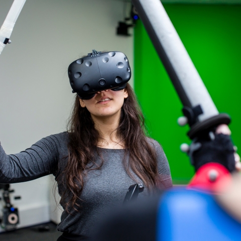 Female student participates in the motion capture studio