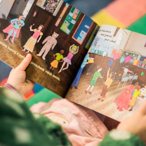 Child holding a picture book