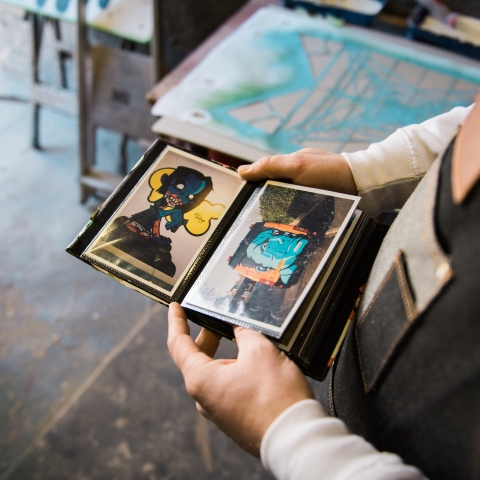 Artist Eric Downer looking at work in his studio