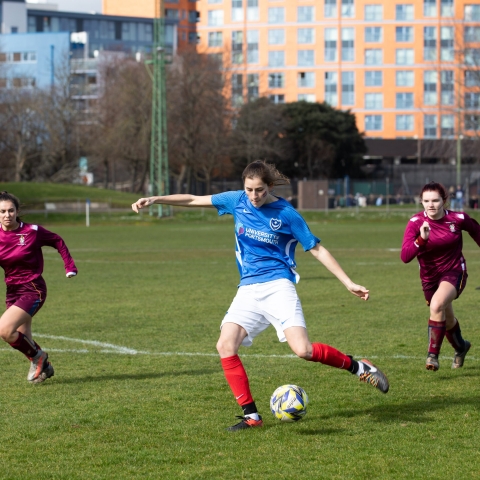 Women football players on a pitch at Varsity