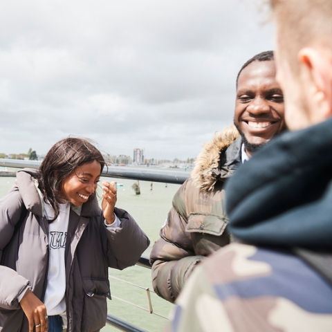 BAME Students laughing at the seaside