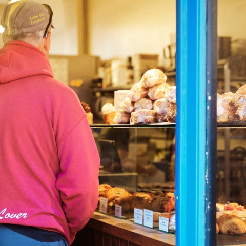 Shopper in Pink Hoodie examining food on display
Bread Addiction - Elm Grove - City Guide 2022