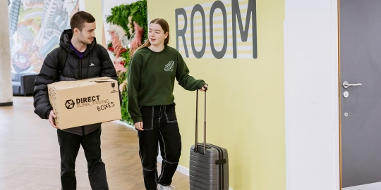 Two students moving in to halls of residence 