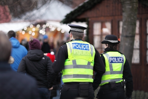 Two police officers in busy street