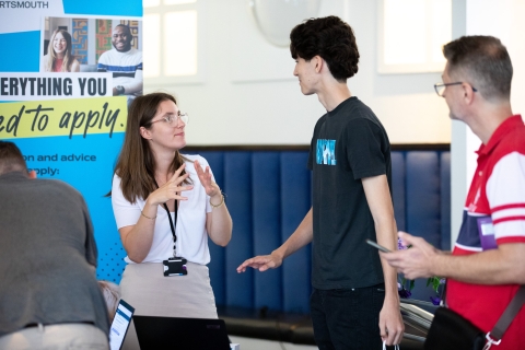 Parents and students talking with staff at the information fair  - Open Day 2023