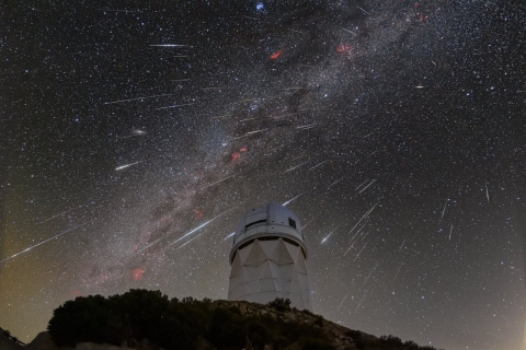 DESI observes the sky from the Mayall Telescope, shown here during the 2023 Geminid meteor shower