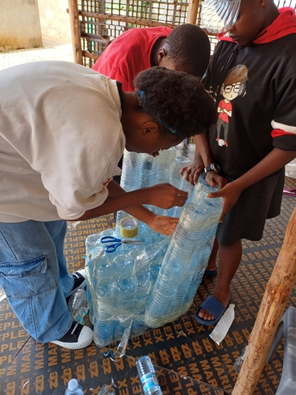 Waste Wise team constructing a chair with plastic bottles