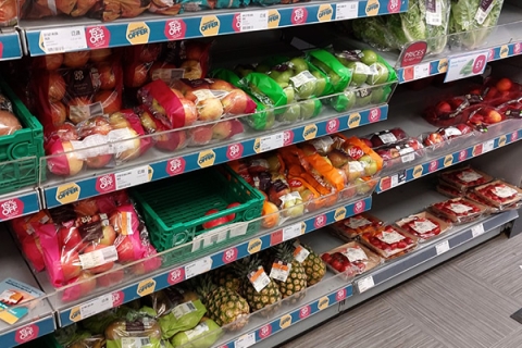 Plastic wrapped fruit and vegetables in a UK supermarket
