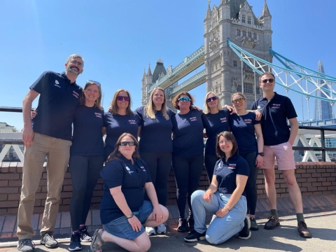 The rowers and the scientists by Tower Bridge in London