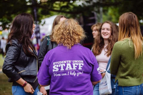 University of Portsmouth student union volunteer speaking to new students