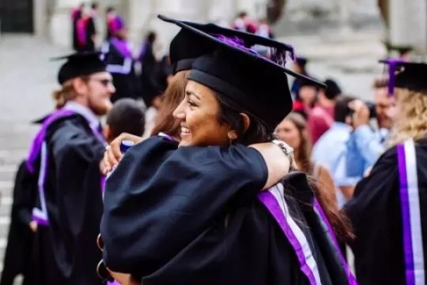 Two students hugging at Graduation 
