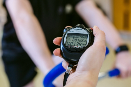 stopwatch being held by female professor