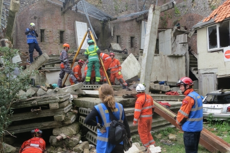 Disaster recovery team cleaning up rubble