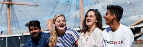 students smiling at portsmouth historic dockyard
