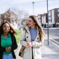 Two students walking down pathway in Old Portsmouth